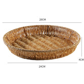 Large round plate-style basket in plastic rattan, ideal for organizing and displaying items in any room.